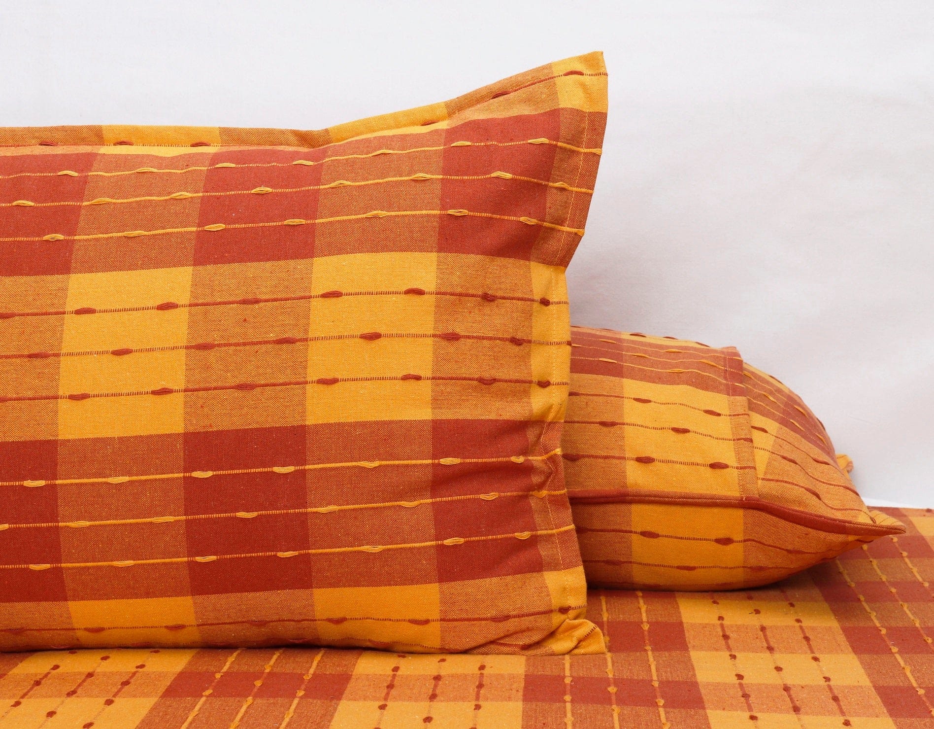 Cotton Designer Dobby Checkered Bedsheet with Pillow Covers (Maroon, Yellow)